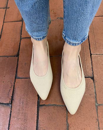 editor in the tan colored flats