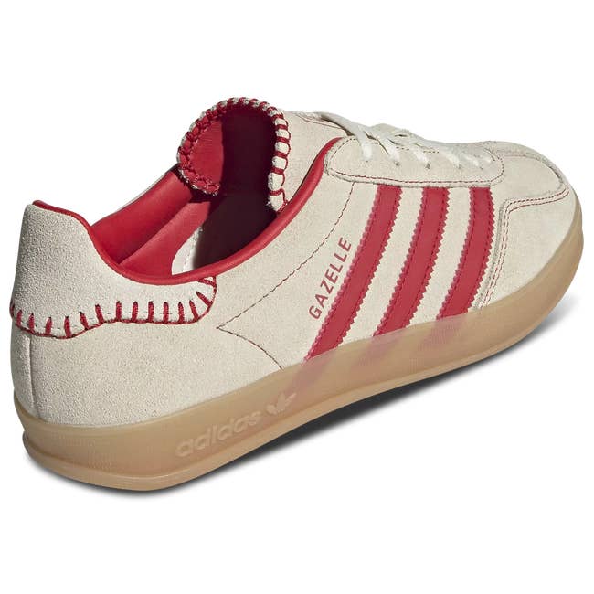 Adidas Gazelle sneaker with suede finish and distinctive red stripes, highlighting style and comfort
