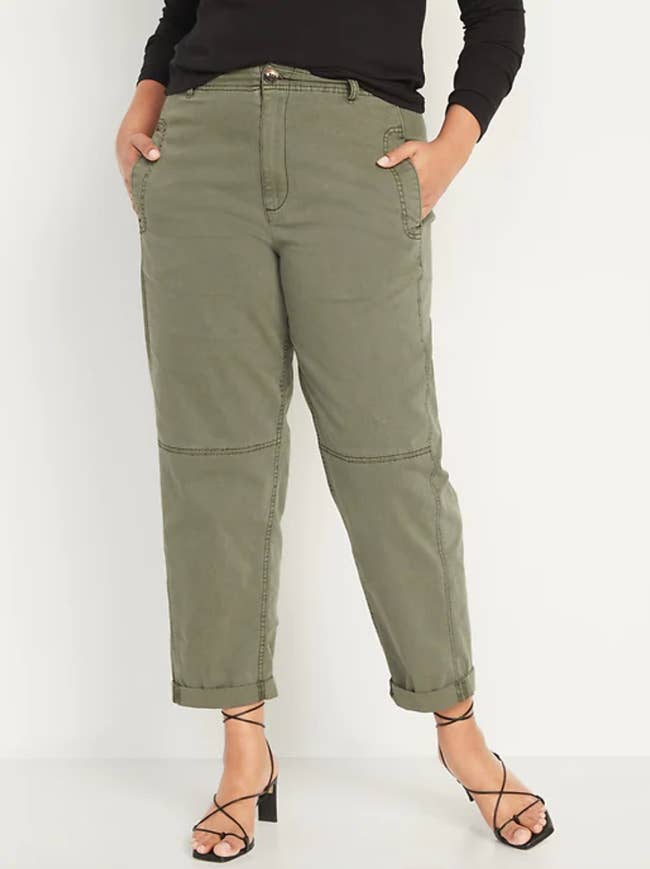 Model wearing the pants in olive green