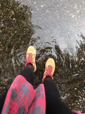 reviewer photo wearing the boots in shallow water