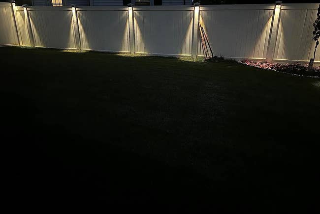 reviewer's fence with solar lights at night