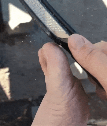 Gif of reviewer using the file on their big toe