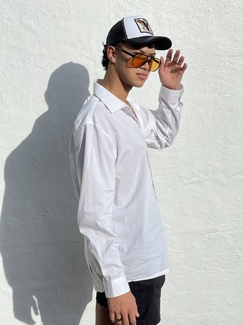 reviewer wearing the orange-tint sunglasses