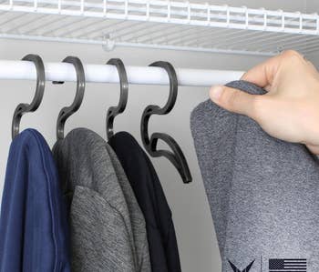 Set of five hoodie hangers in closet