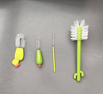 a set of bottle brushes that look like cacri