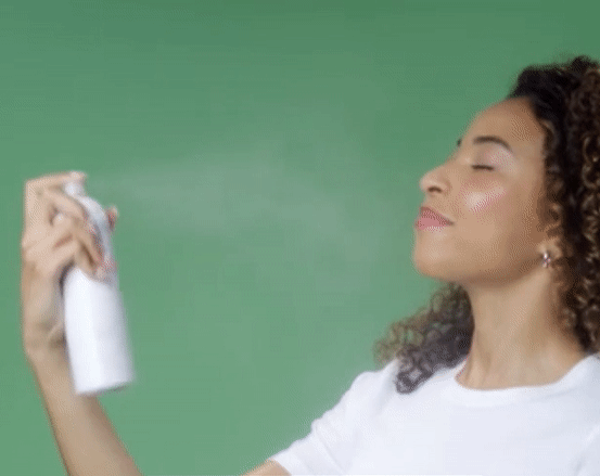 gif of model spraying the mist on their face