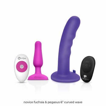 Fuchsia butt plug with white wireless remote and purple dildo with black wireless remote