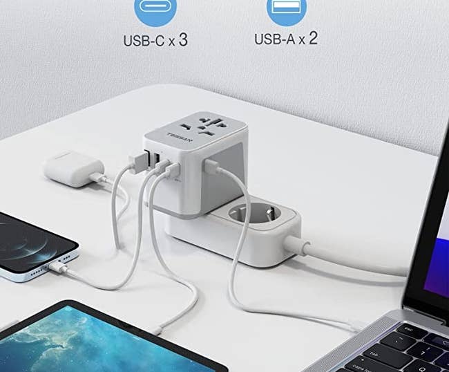 Four electronics plugged into adapter