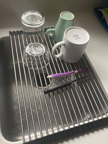 a reviewer using the rack for dishes
