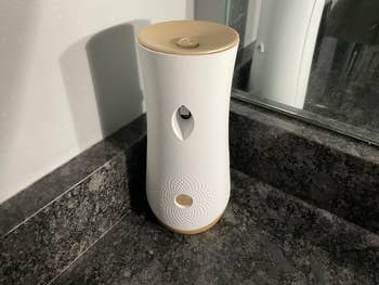 reviewer image of the white glade scent dispenser on a countertop