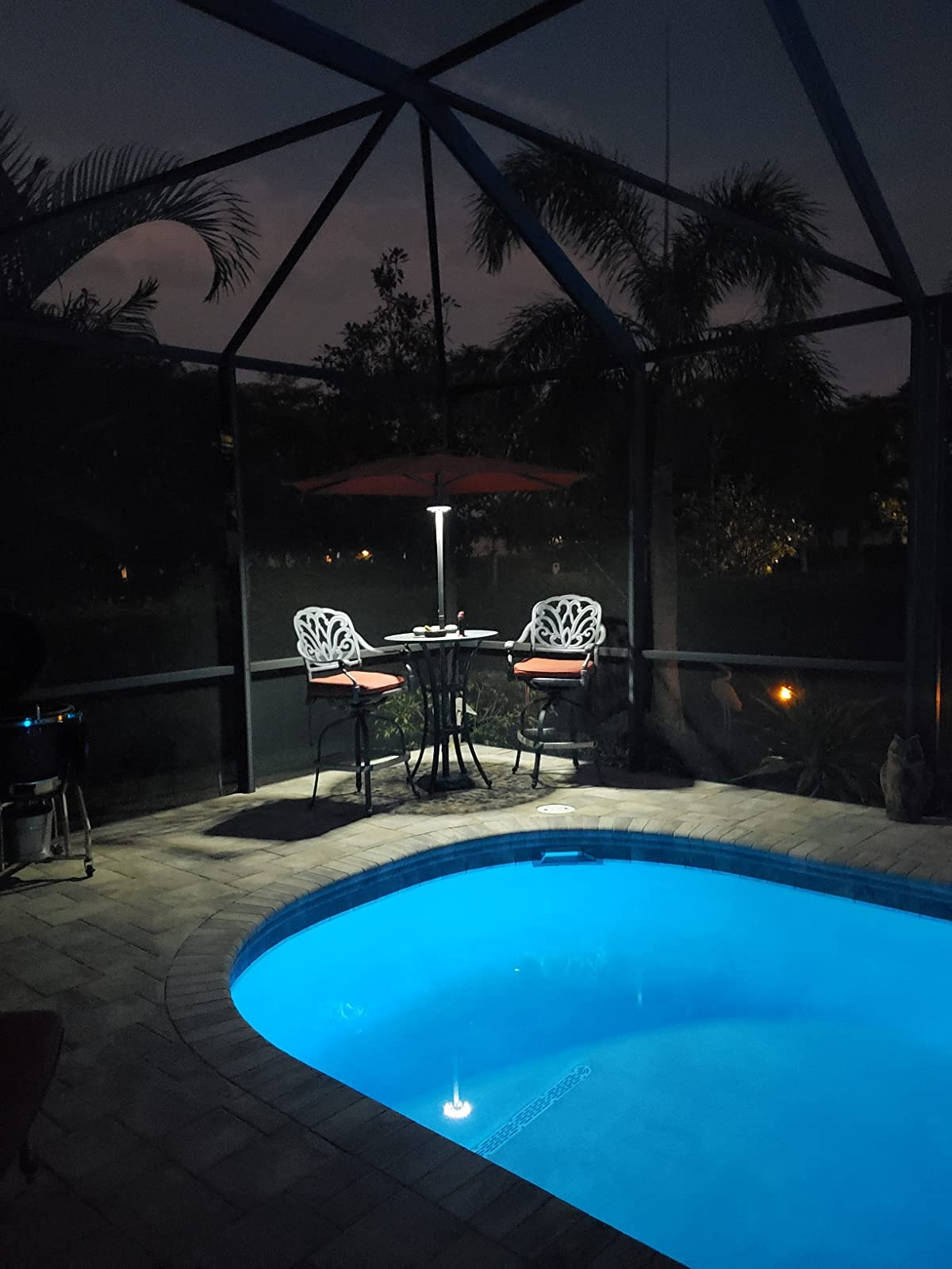 reviewer image of the light on a patio umbrella at night