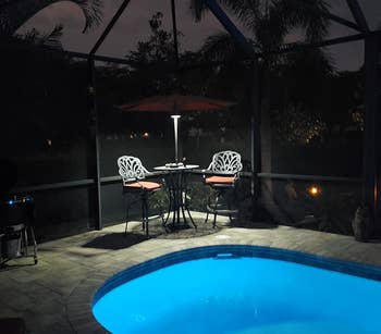 reviewer image of the light on a patio umbrella at night