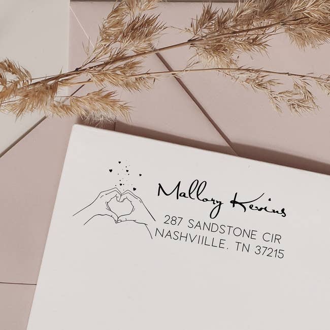 Elegant envelope with floral sketch and handwritten-style code for Mallory Kevins, Nashville, TN. Pampas writer decorates the scene