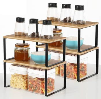 four of the shelf organizers with items on top and underneath  