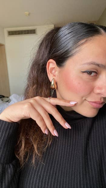 the reviewer wearing the earrings