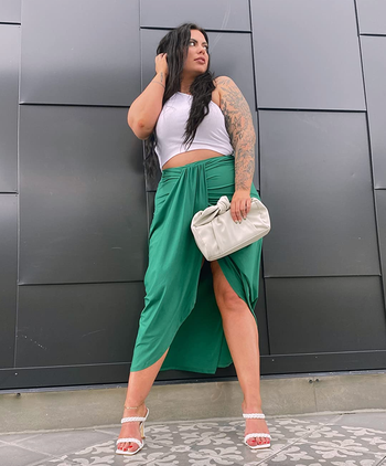reviewer wearing the green skirt