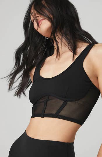 model wearing corset sports bra in black
