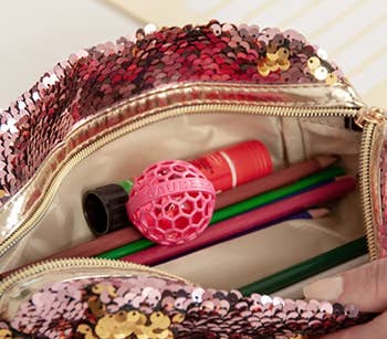 the clean ball being used in a bag with colored pencils