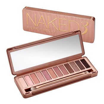 The Urban Decay Naked 3 palette, with its packaging behind it