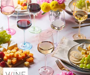 six stemmed wine glasses in translucent pale pastel colors 