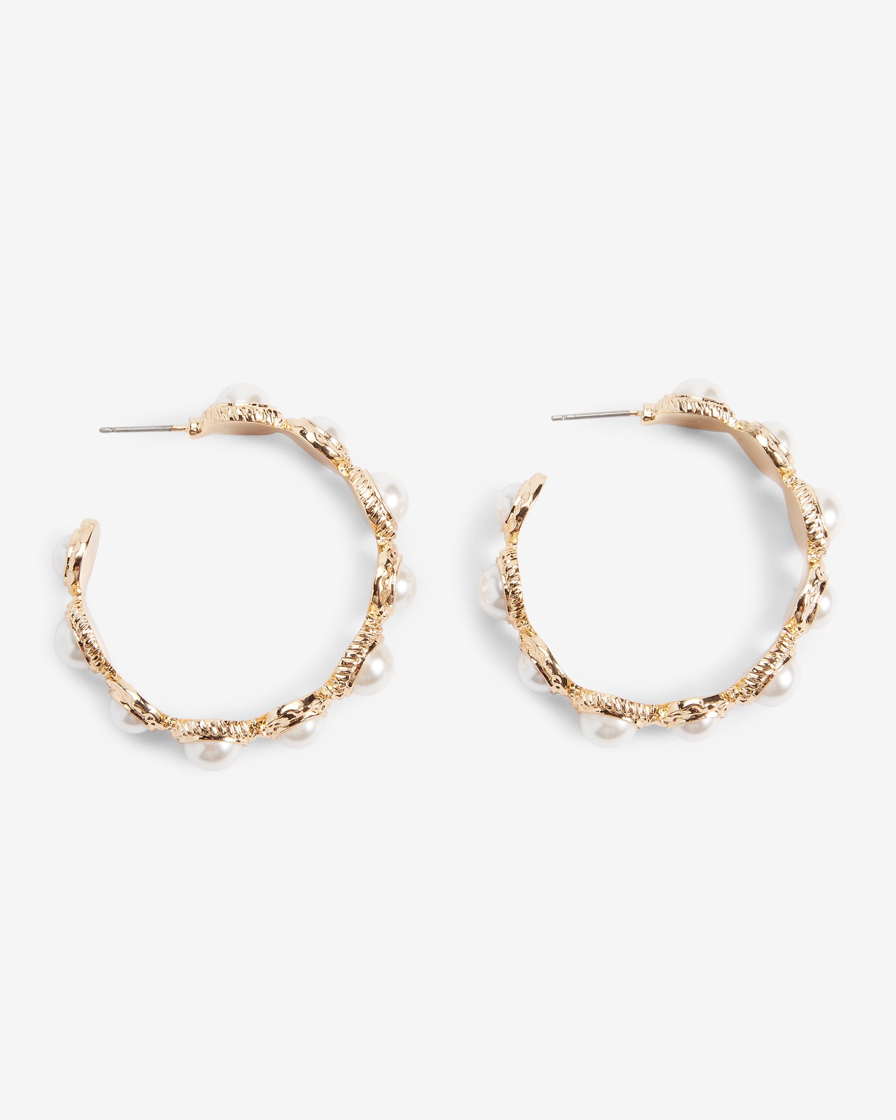 Gold hoop earrings surrounded by row of diamonds