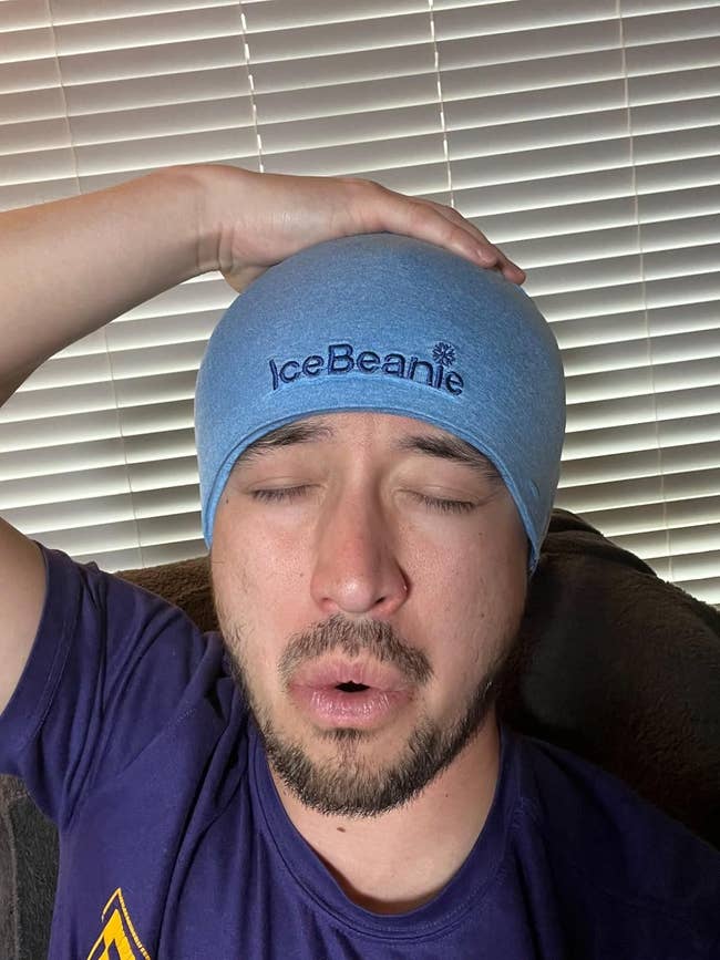 Person wearing IceBeannie on forehead with eyes closed, possibly indicating relaxation or headache relief