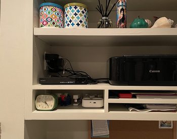 reviewer's shelf before, with tangle of cords