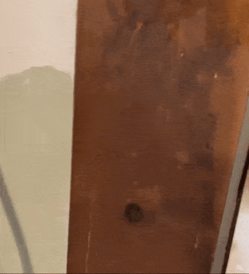 A gif of a reviewer cleaning their wood trim