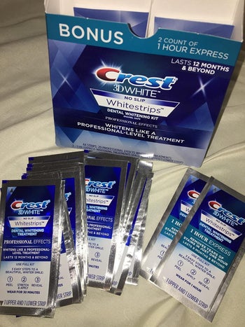 Reviewer's Crest whitening strips laid out in front of the product box