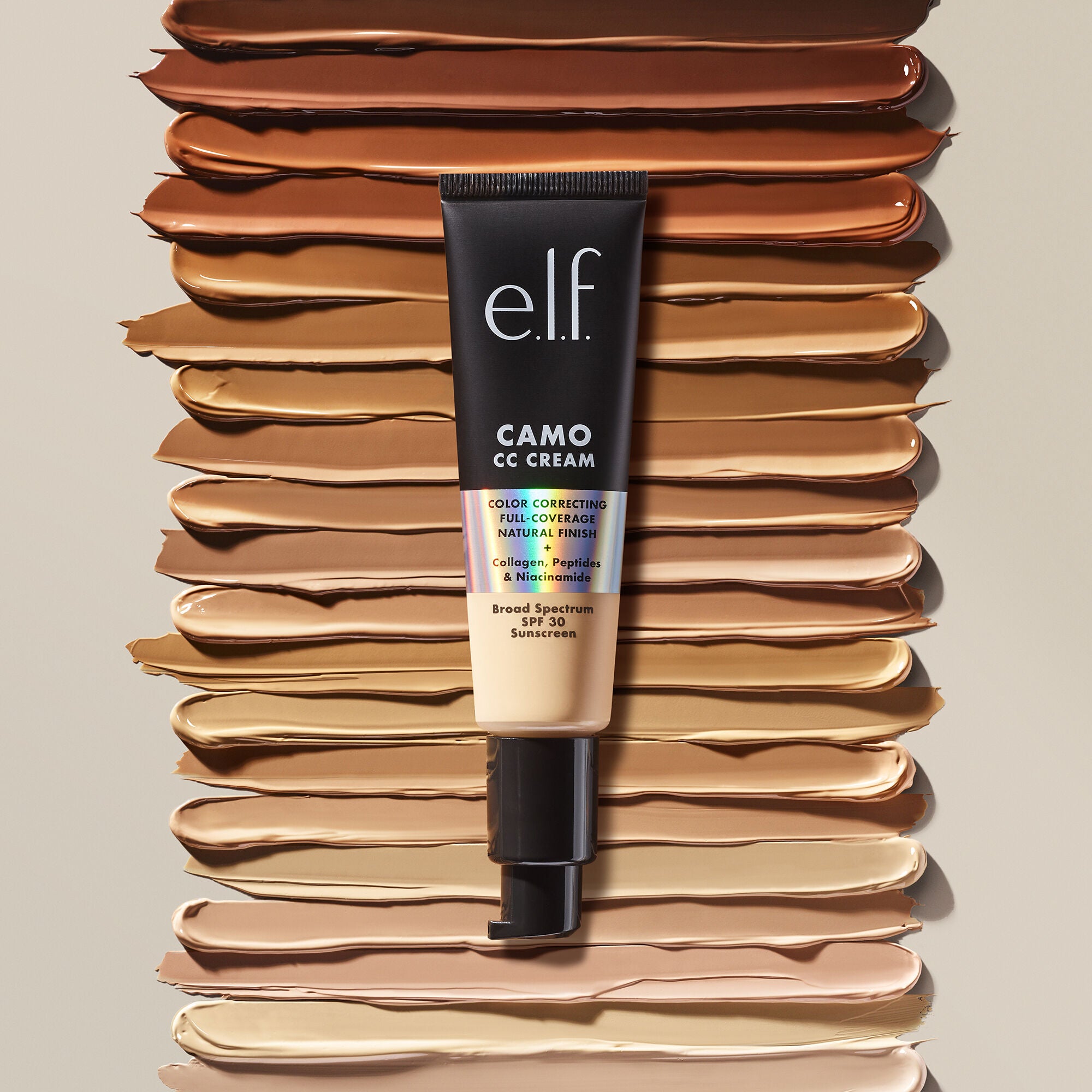 Bottle of cc cream on top of swatches of all the shades
