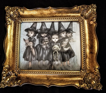 a reviewer photo of the frame in gold 