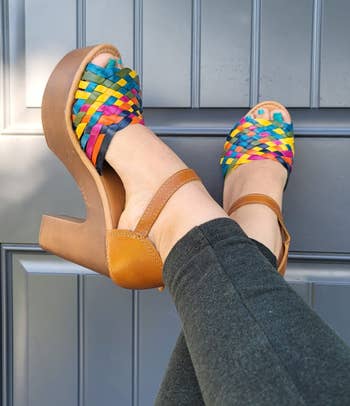 model's feet wearing the colorful wedges with leggings