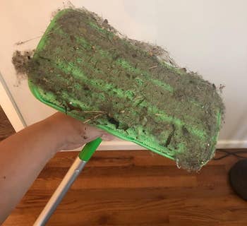 a different reviewer's mop pad covered in dust