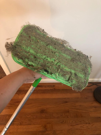 a different reviewer's mop pad covered in dust