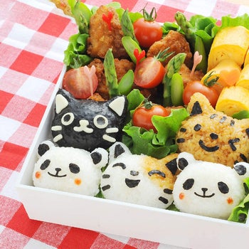 a bento box full of animal-shaped rice balls