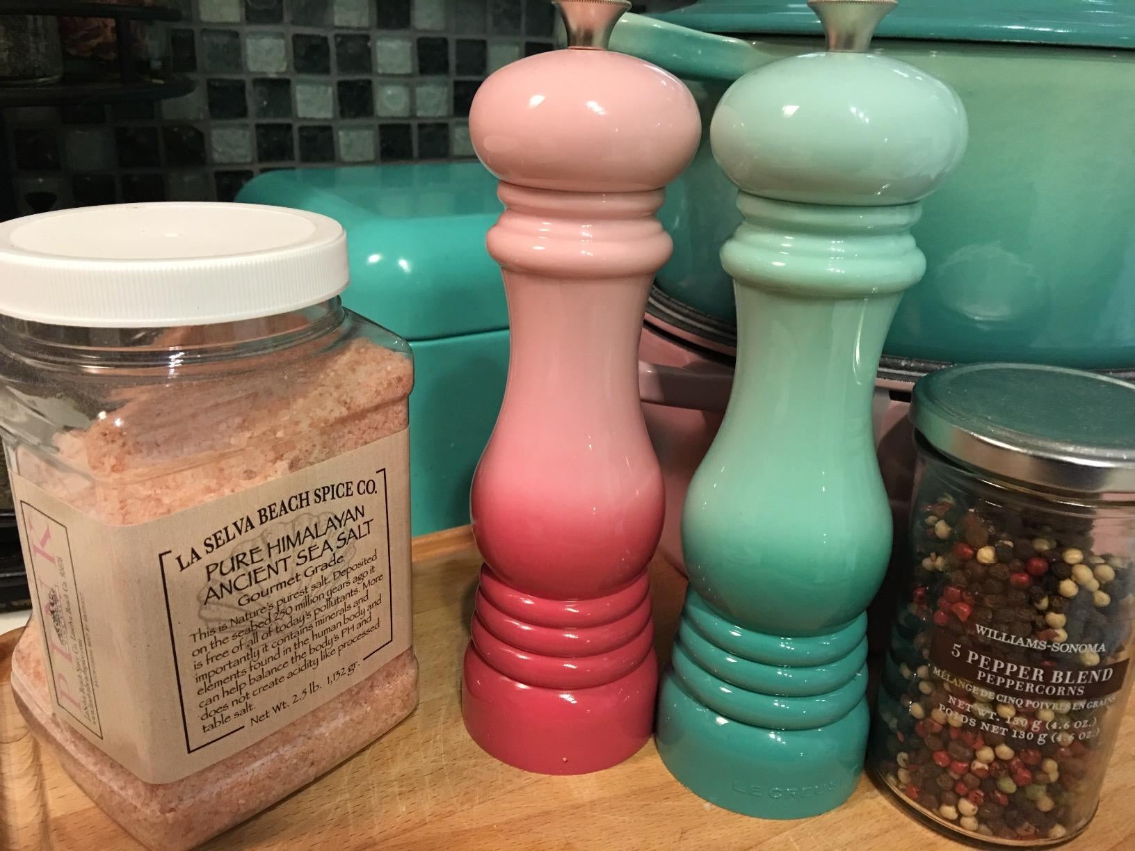 two ombre mills for salt and pepper, one pink and one green