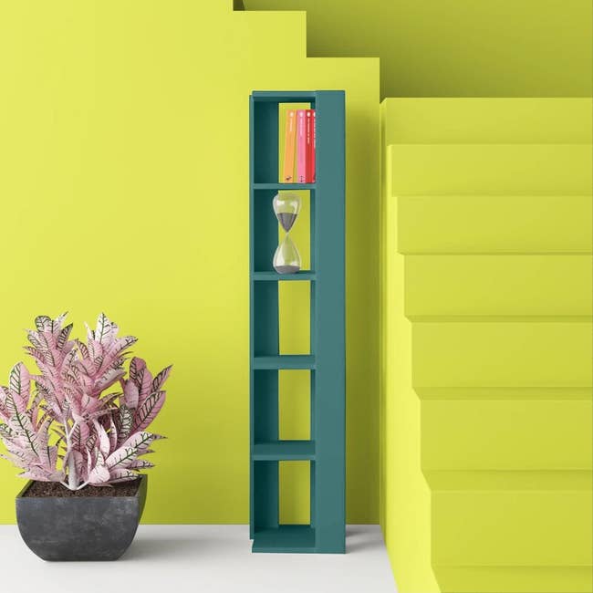 the ultra slim bookcase in a bold medium dark green 