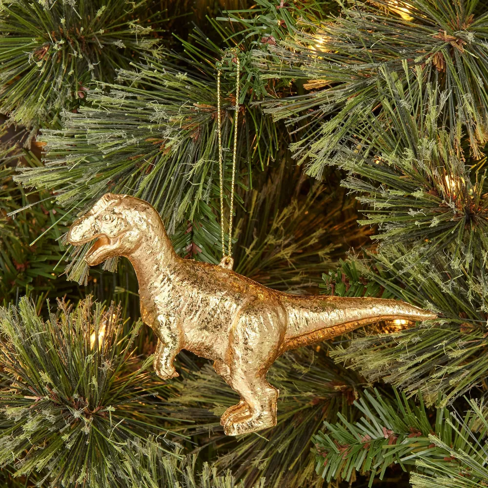 a gold t-rex ornament