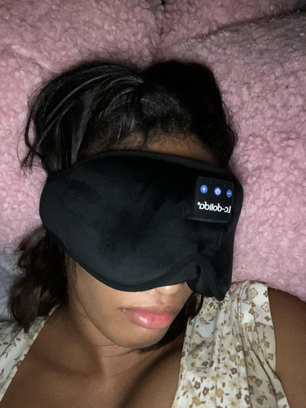Person wearing a achromatic  slumber  disguise  connected  a fluffy pillow
