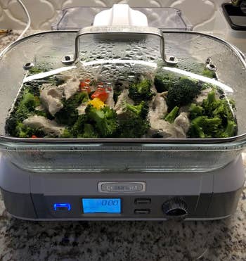 reviewer photo of vegetables cooking in the steamer