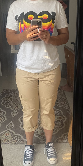 front view of reviewer wearing the tan pants with a tee and sneakers
