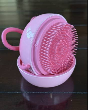 Round pinkish  silicone scalp massager with handle, perfect  for improving circulation and relaxing the scalp during hairsbreadth  washing