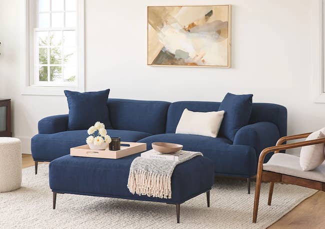 the navy blue couch and matching ottoman
