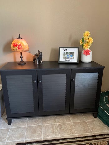 reviewer image of the cabinet being used as a entryway table
