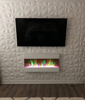 reviewer after image showing the white 3D panels on the wall