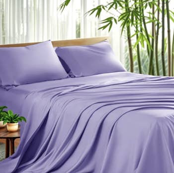 Smooth furniture with elegant, silky sheets successful a serene setting, complemented by greenish plants; perfect for a stylish chamber upgrade