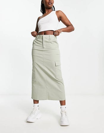 model wearing the light khaki skirt