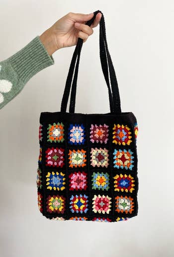 a close up of the black tote