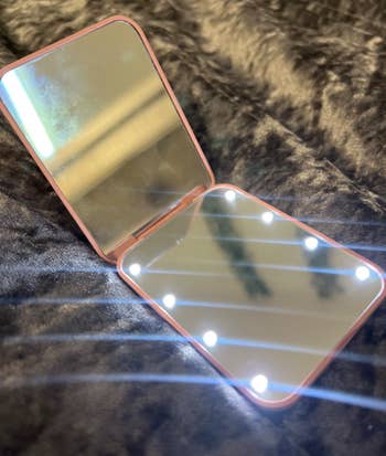 Open compact mirror with built-in LED lights
