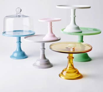 assorted glass cake stands in different colors
